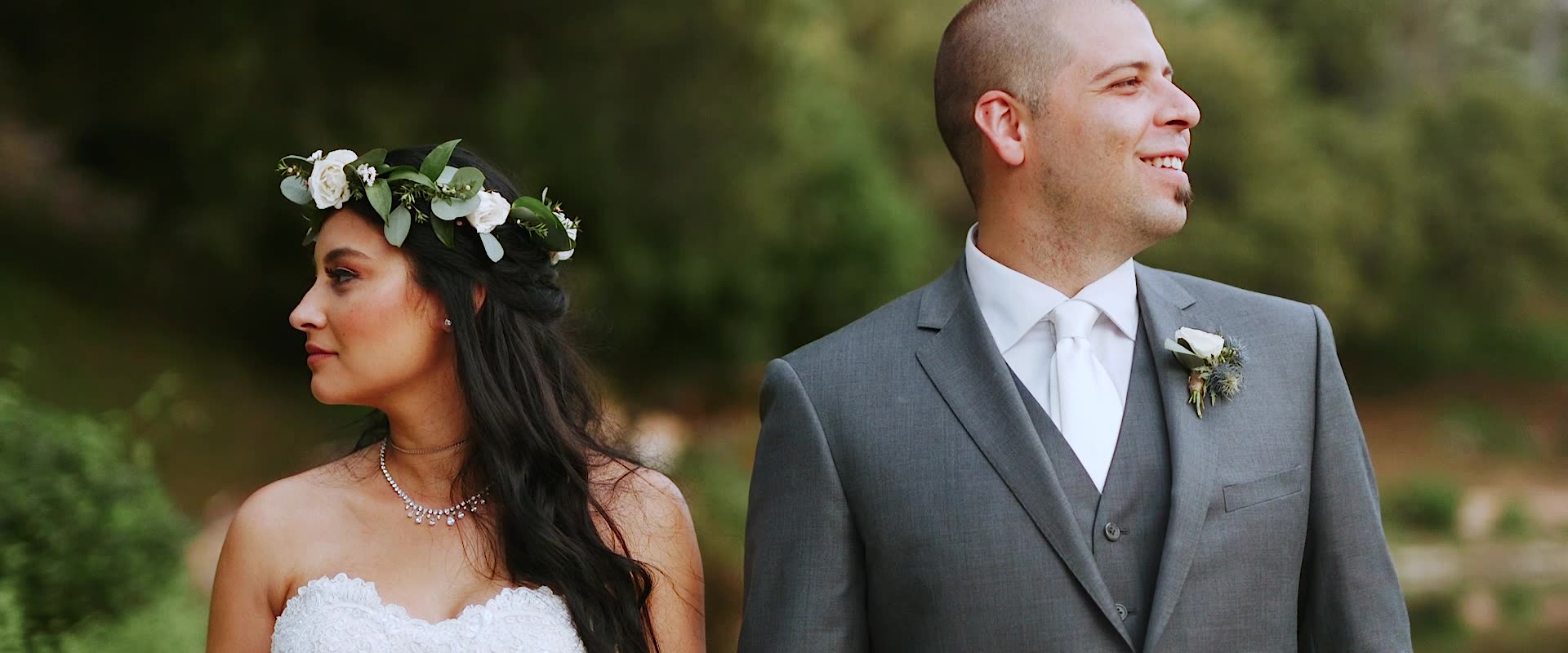 Alex and Bri outdoors among the greenery at Los Willows, the bride in a flower crown