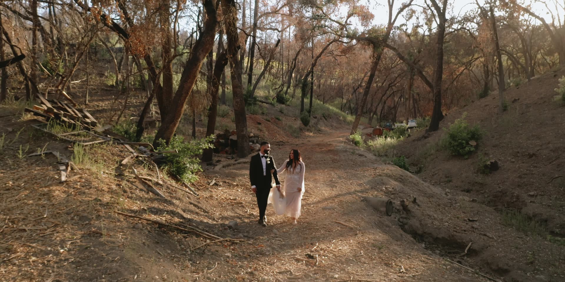 Anthony and Gabi walking the wooded path together in Calistoga
