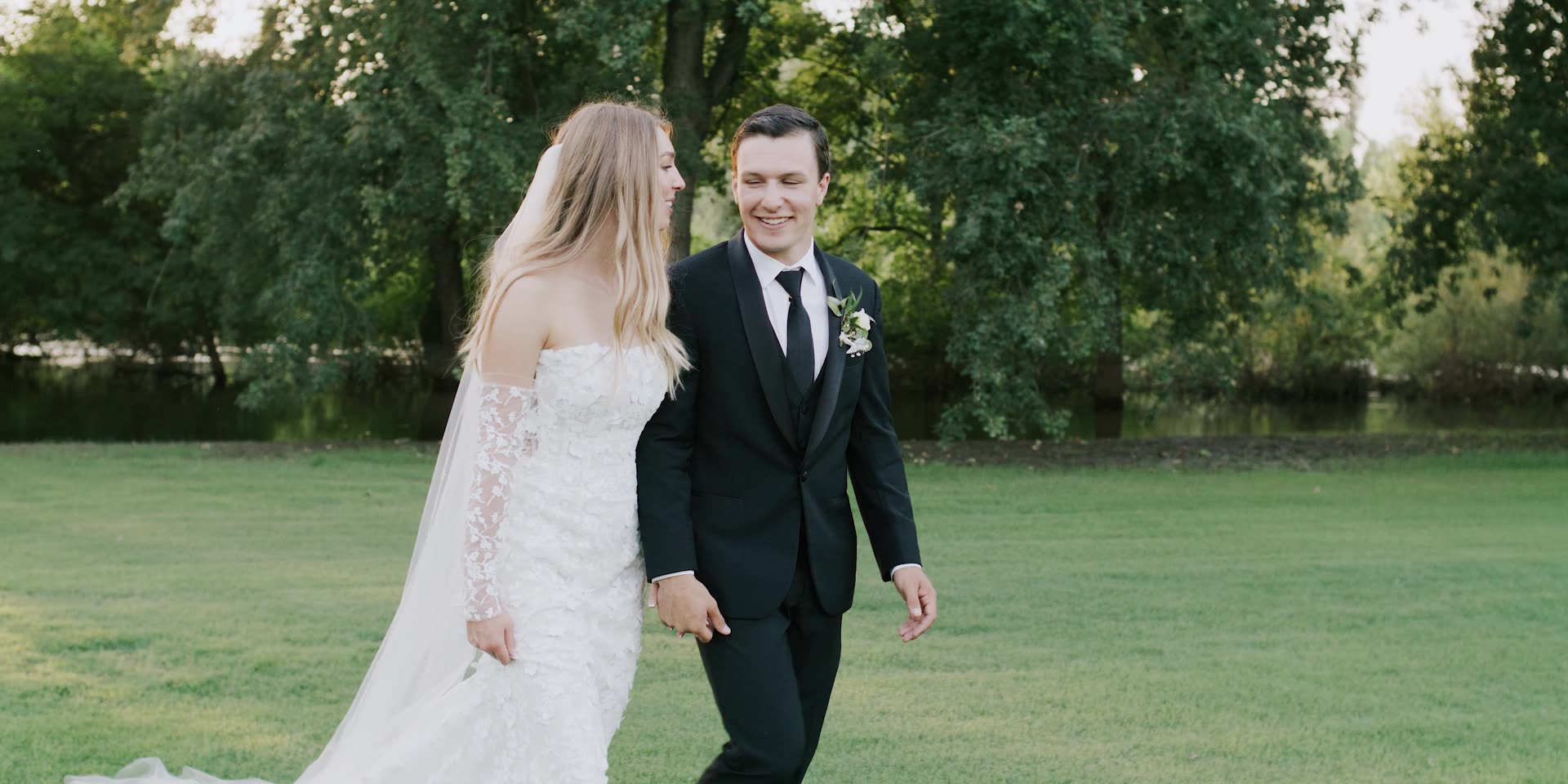 Anna and Jett walking the lawn together after the ceremony in Kingsburg