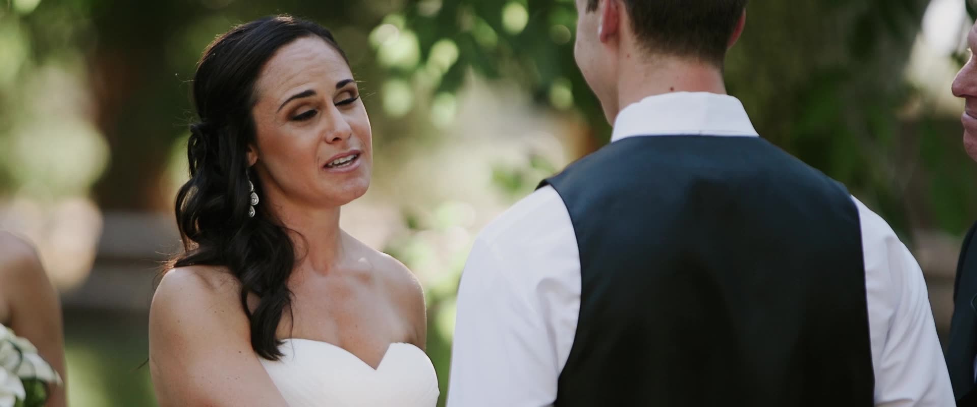 Alexis and Lindsay exchanging vows at the altar at Westlake Village Inn