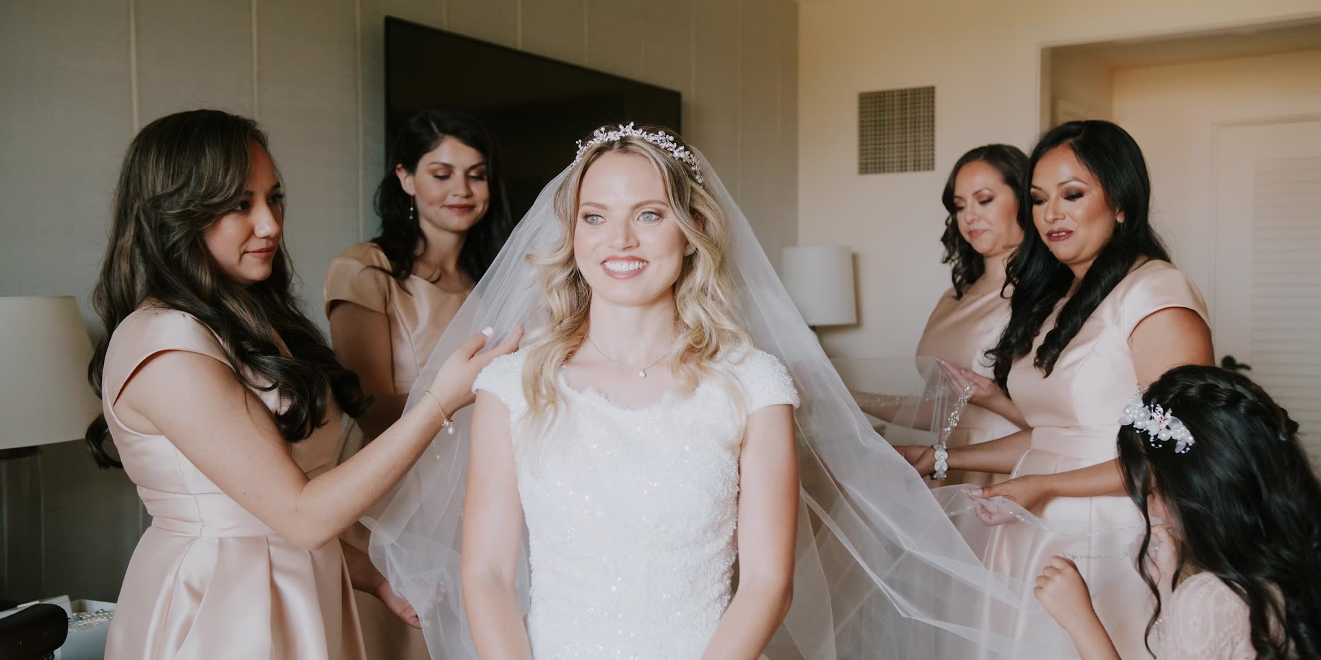 Sloane and her bridesmaids fixing her veil before the ceremony at Terranea Resort