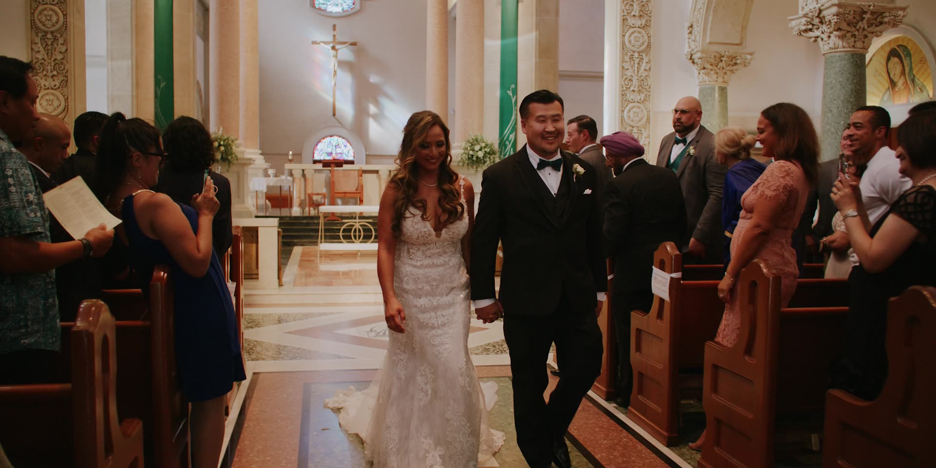 Brian and Andrea's recessional down the church aisle in San Diego