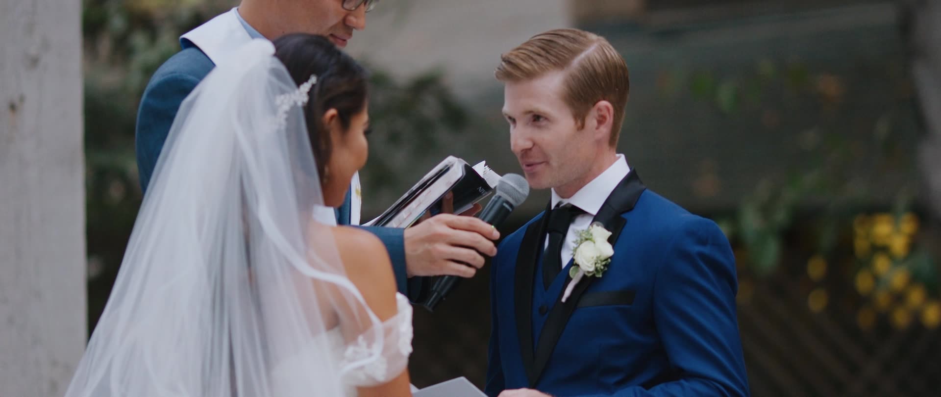 Ben and Catherine exchanging vows at the altar at Calamigos Ranch