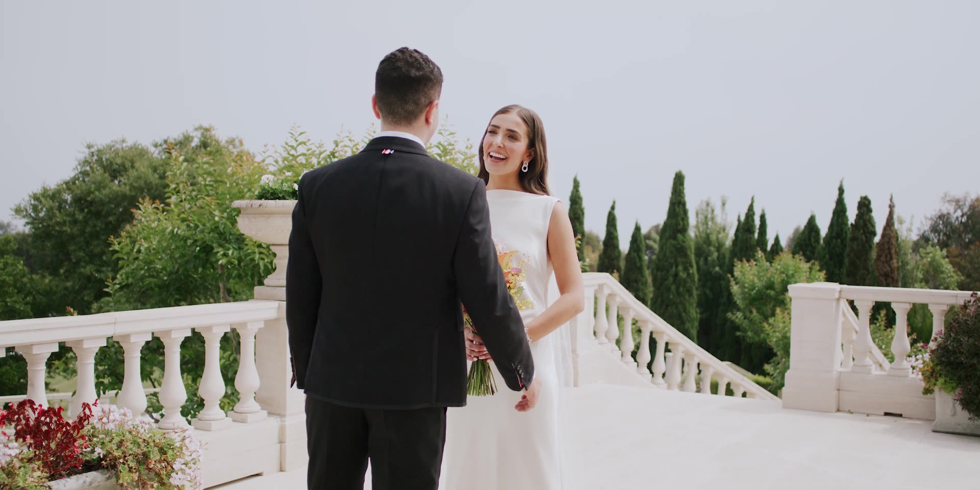 Brandon and Julie on the balustraded terrace with the cypresses beyond, Carpinteria
