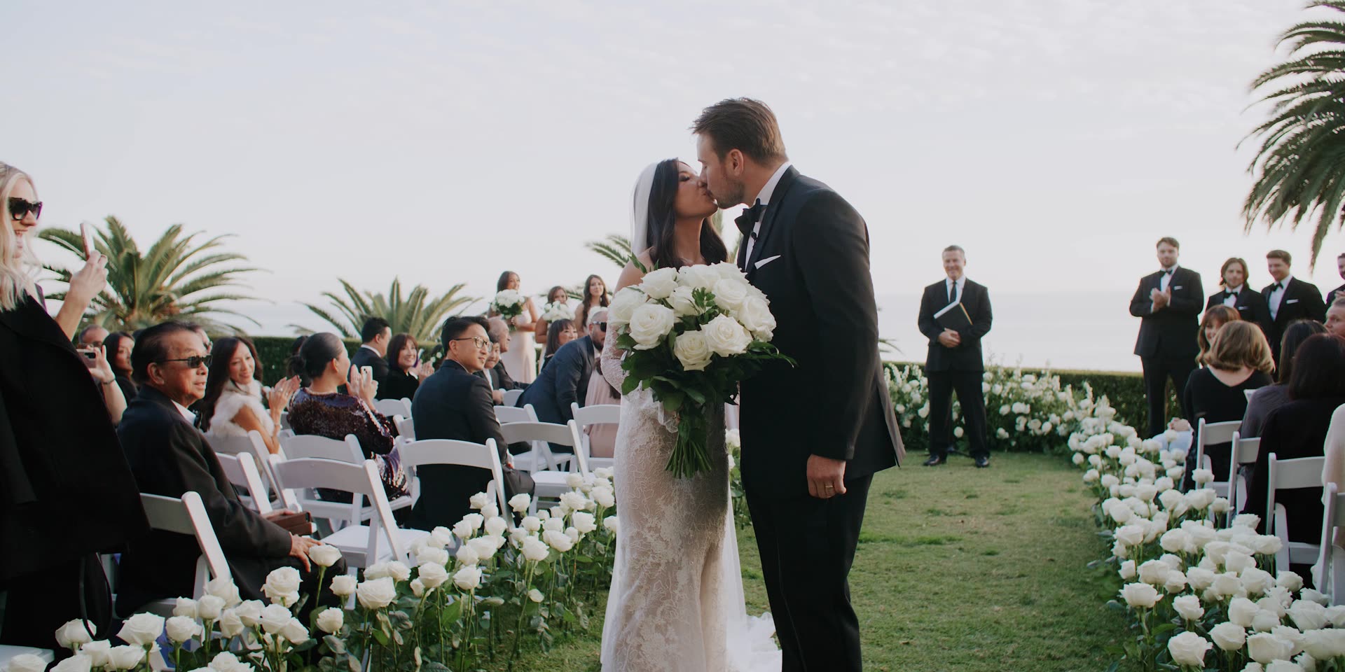 Brendan and Jenna walking back down the aisle with the Pacific behind them at Bel-Air Bay Club