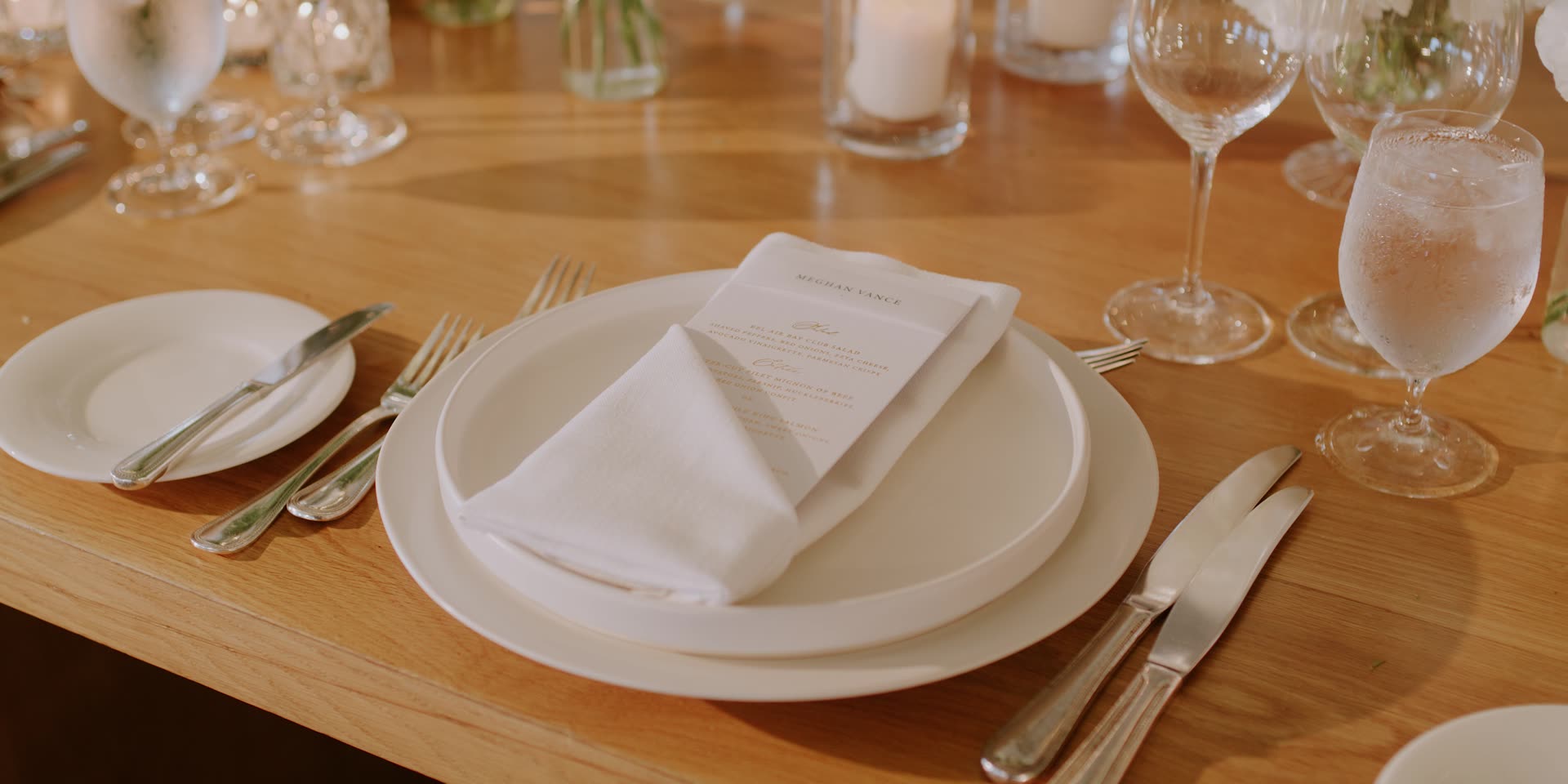 The ballroom set with tall white florals at Bel-Air Bay Club