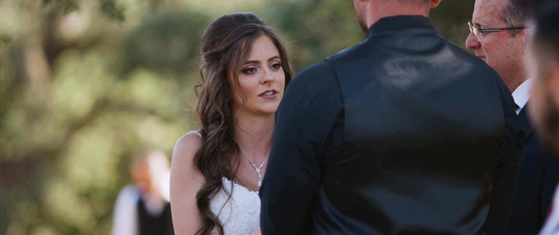 Chris and Andrea exchanging vows at the Murrieta estate