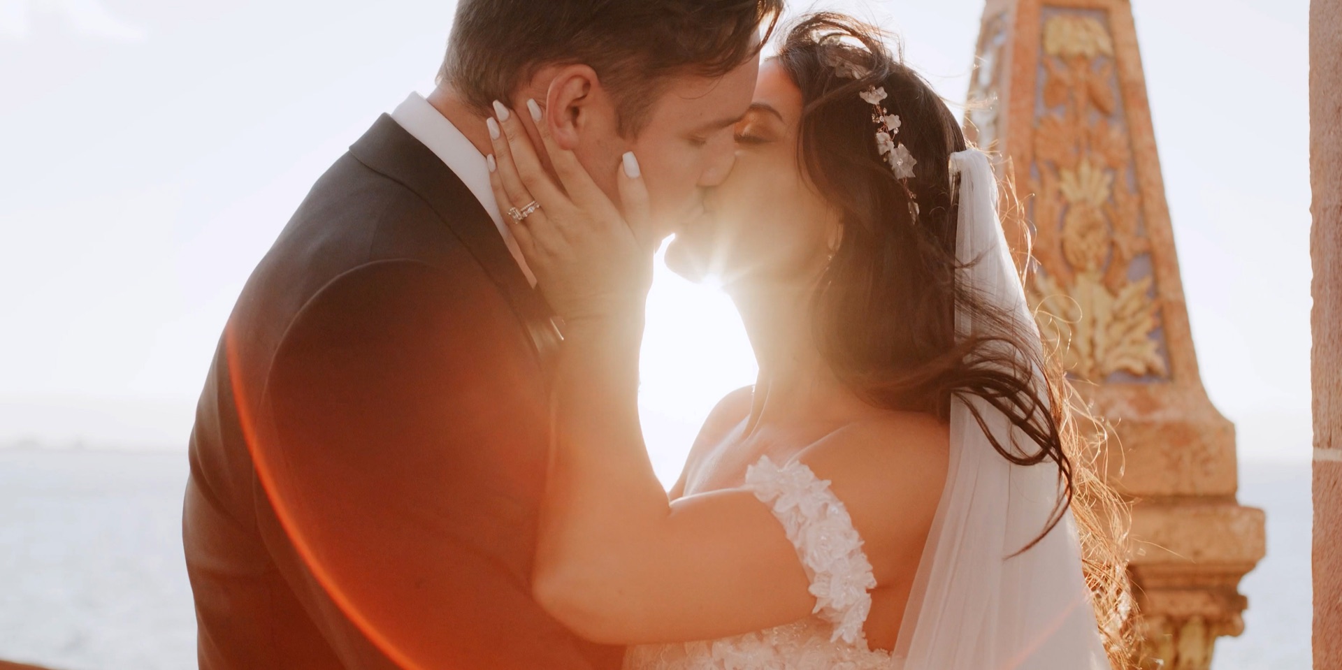 Bride and groom at golden hour beside the ornate tilework at Ca d'Zan in Sarasota