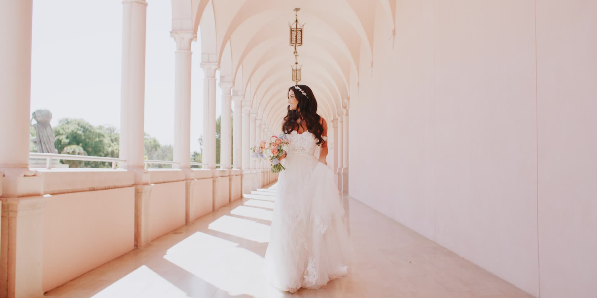 Lauren walking the pink arcaded loggia at Ca d'Zan in Sarasota