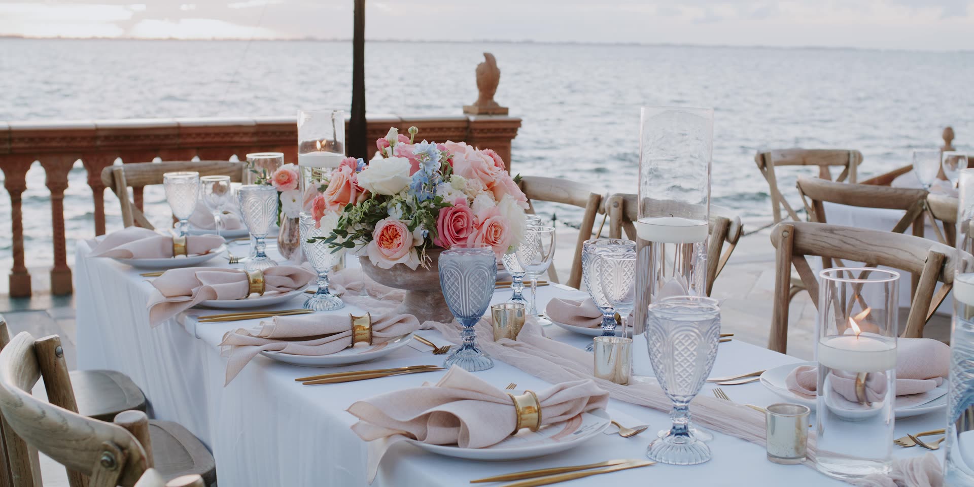 Reception tables set on the terrace above the bay in Sarasota