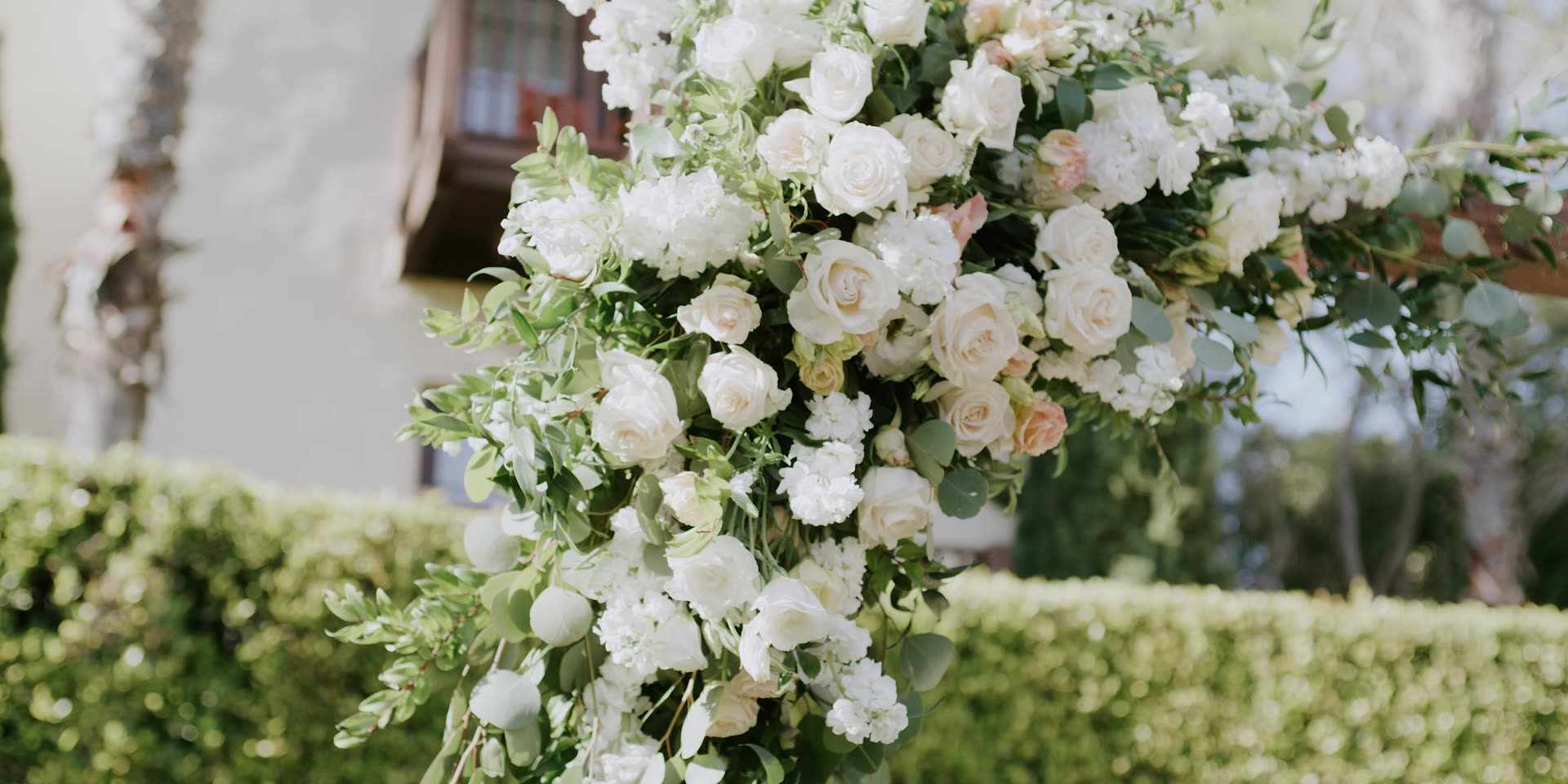 White garden roses in the ceremony florals at Estancia La Jolla