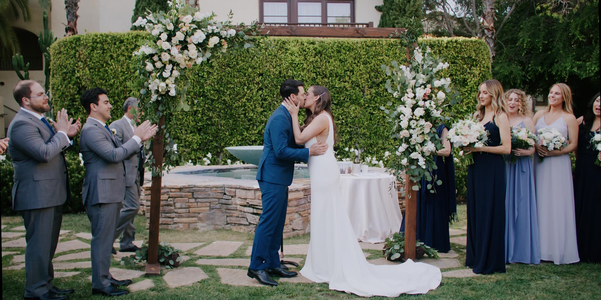Coury and Niko's first kiss beside the fountain at Estancia La Jolla