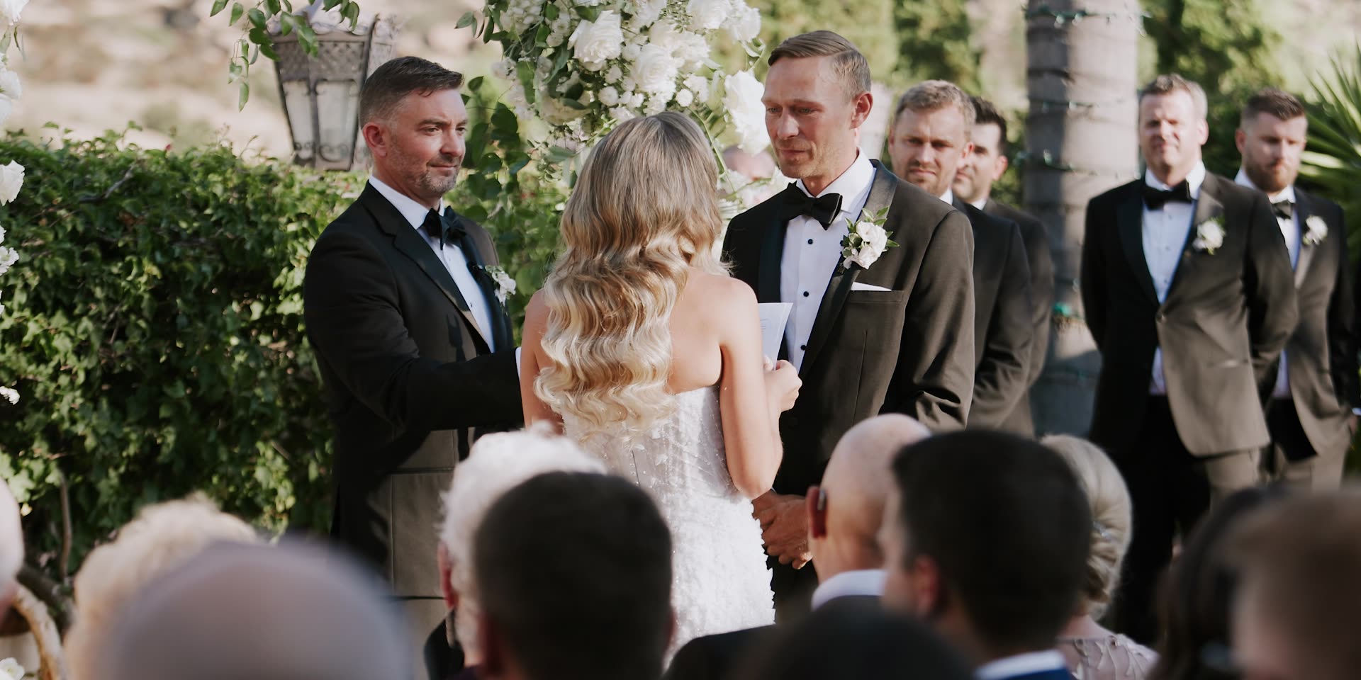 Dave and Alex at the altar with their wedding party at Hummingbird Nest Ranch