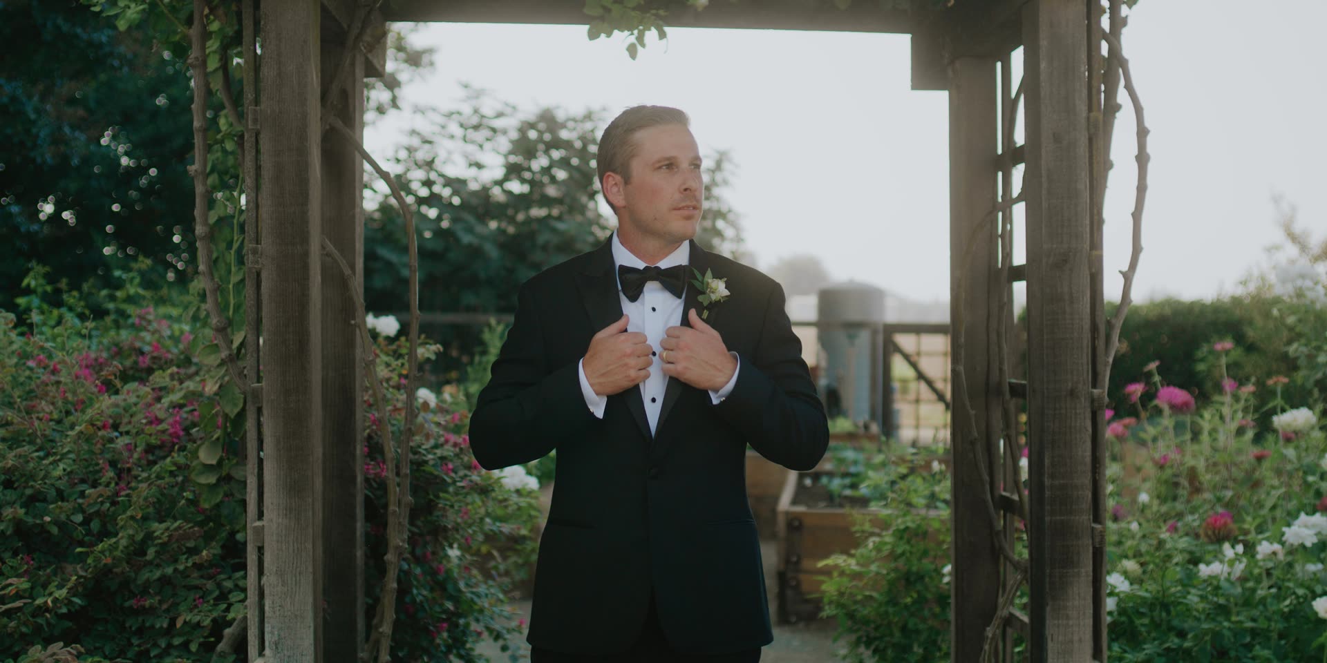 Donnie waiting beneath the arbor in the rose garden in Kingsburg