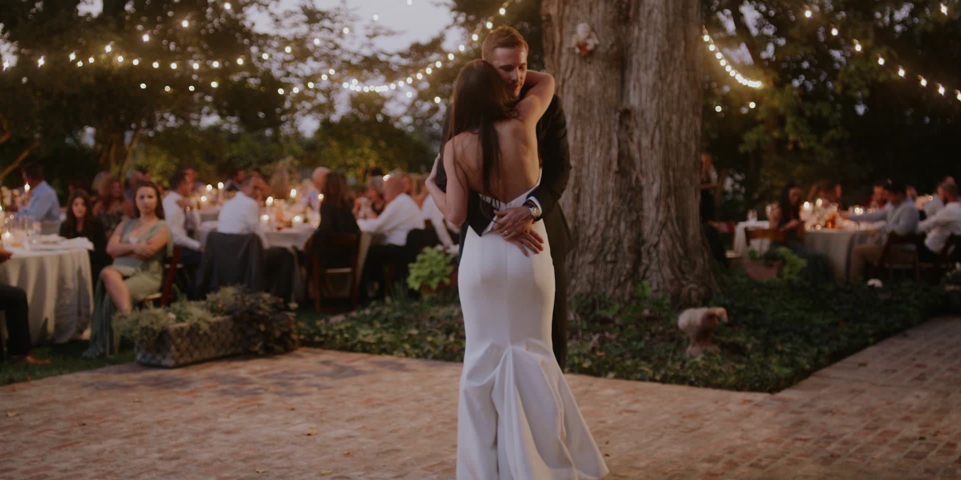 Donnie and Danae's first dance beneath the oak and string lights in Kingsburg