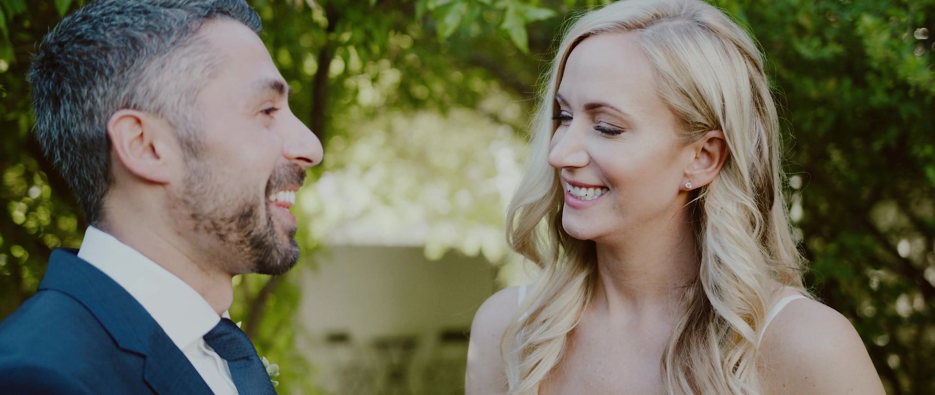 Don and Katherine facing each other, both mid-laugh.