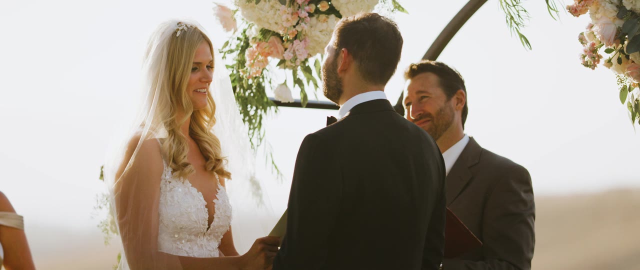 Analise smiling at Eric during their vows at Callaway Winery