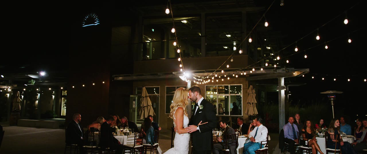 Eric and Analise's first dance on the winery patio under the string lights at Callaway