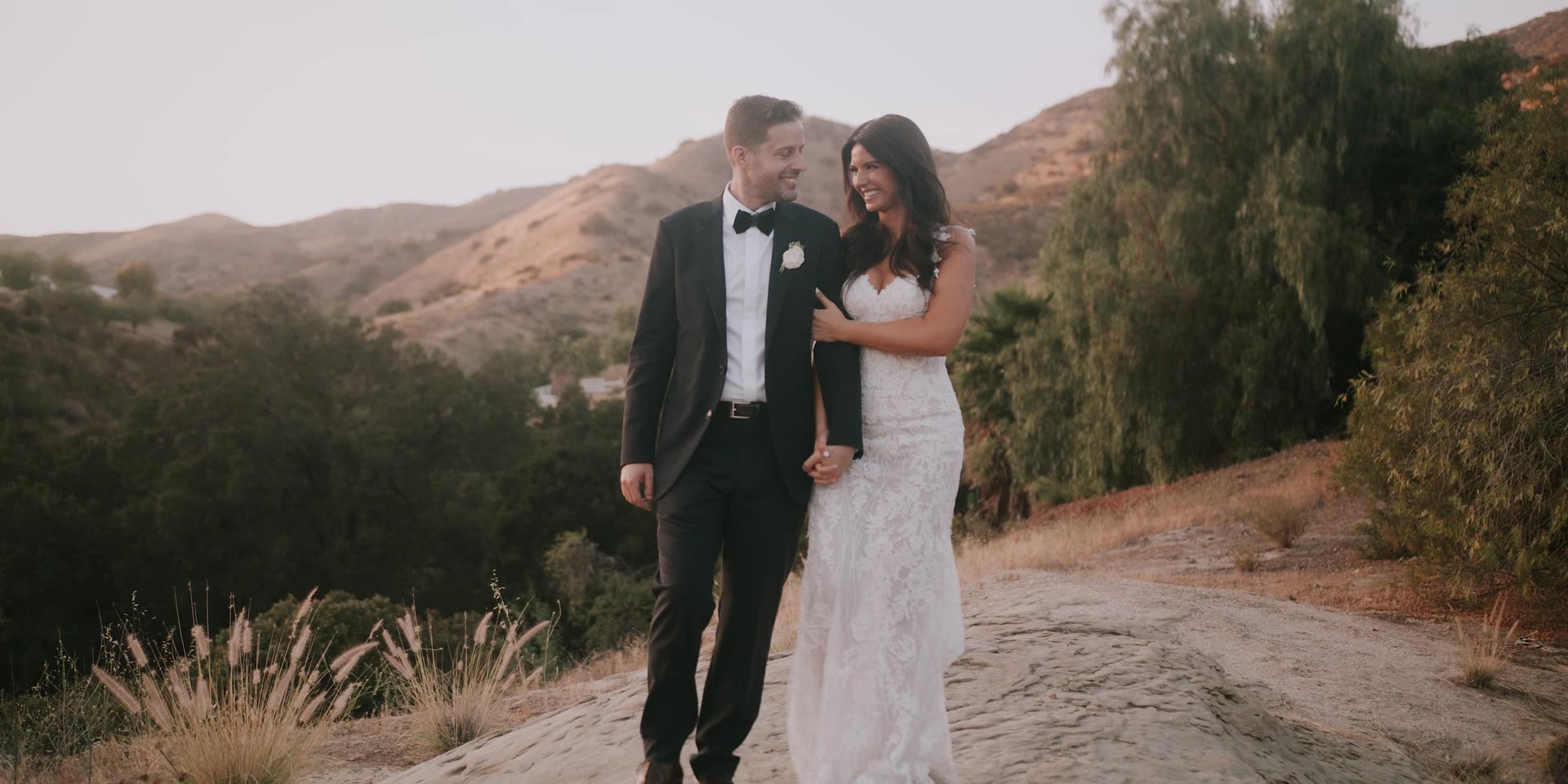 Evan and Kelly together against the hills at Hummingbird Nest Ranch
