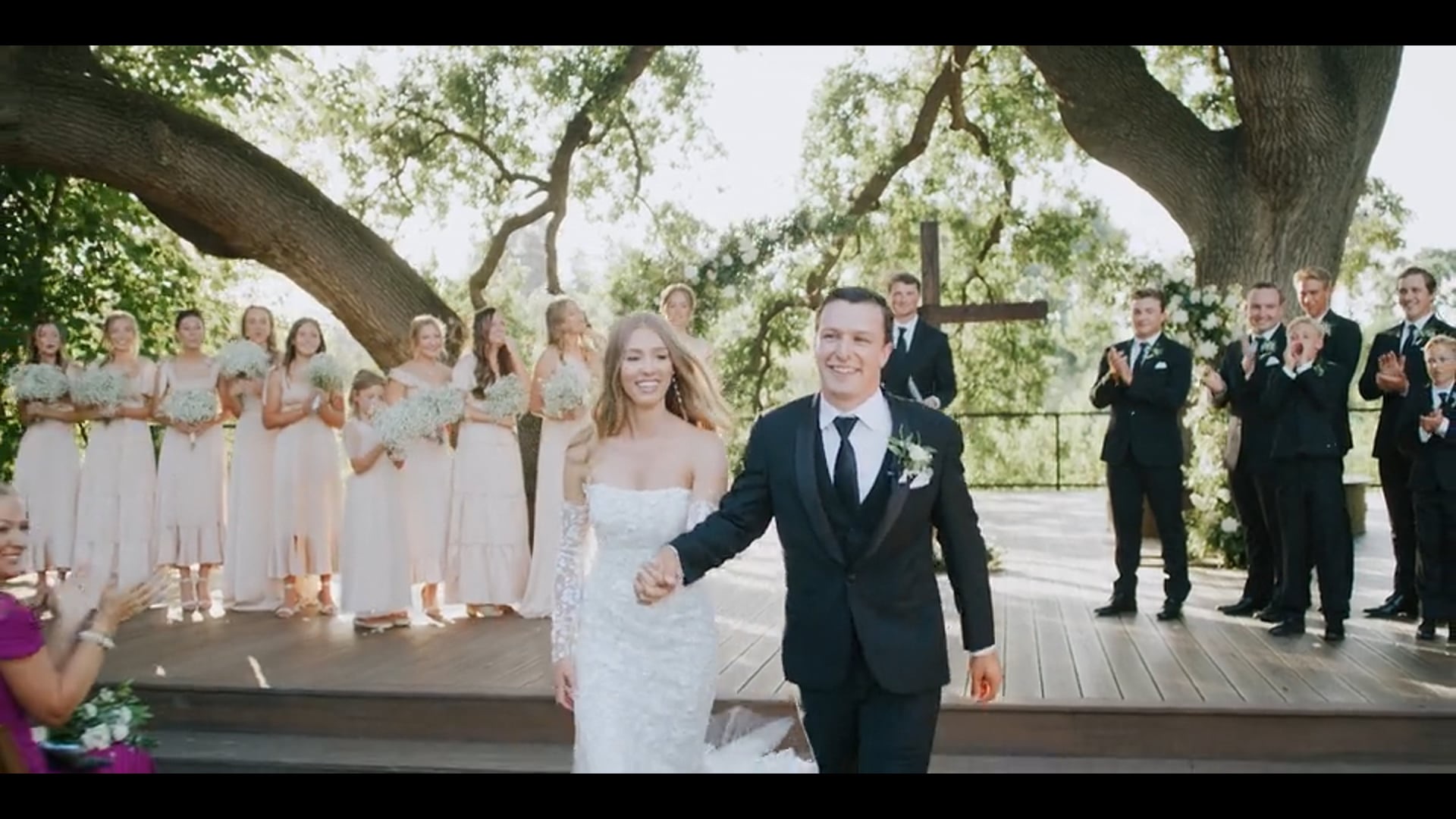 Anna and Jett walking back down the aisle together after their ceremony in Kingsburg, California