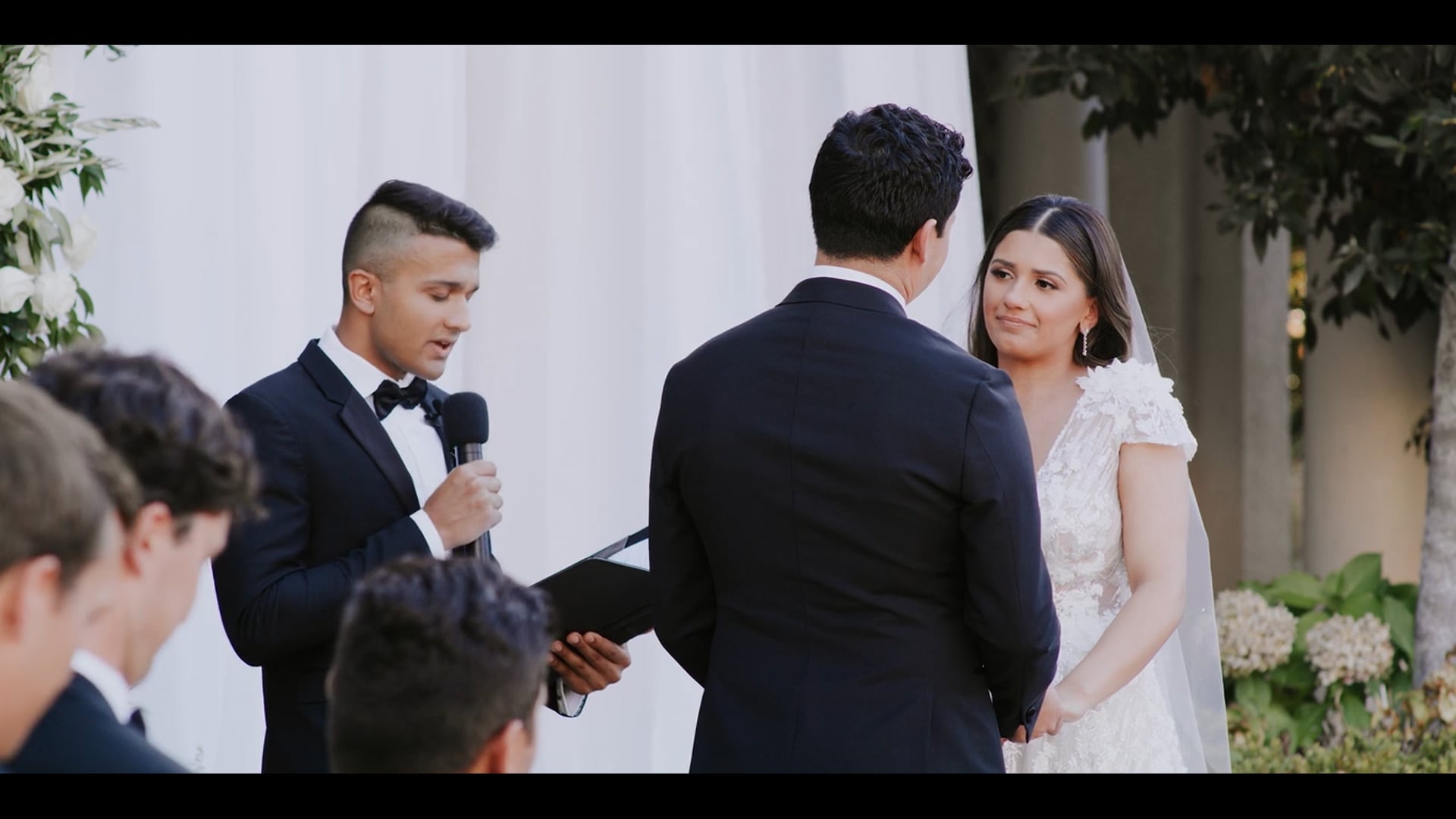 Antonio and Nika exchanging vows beneath the loggia at Villa Montalvo