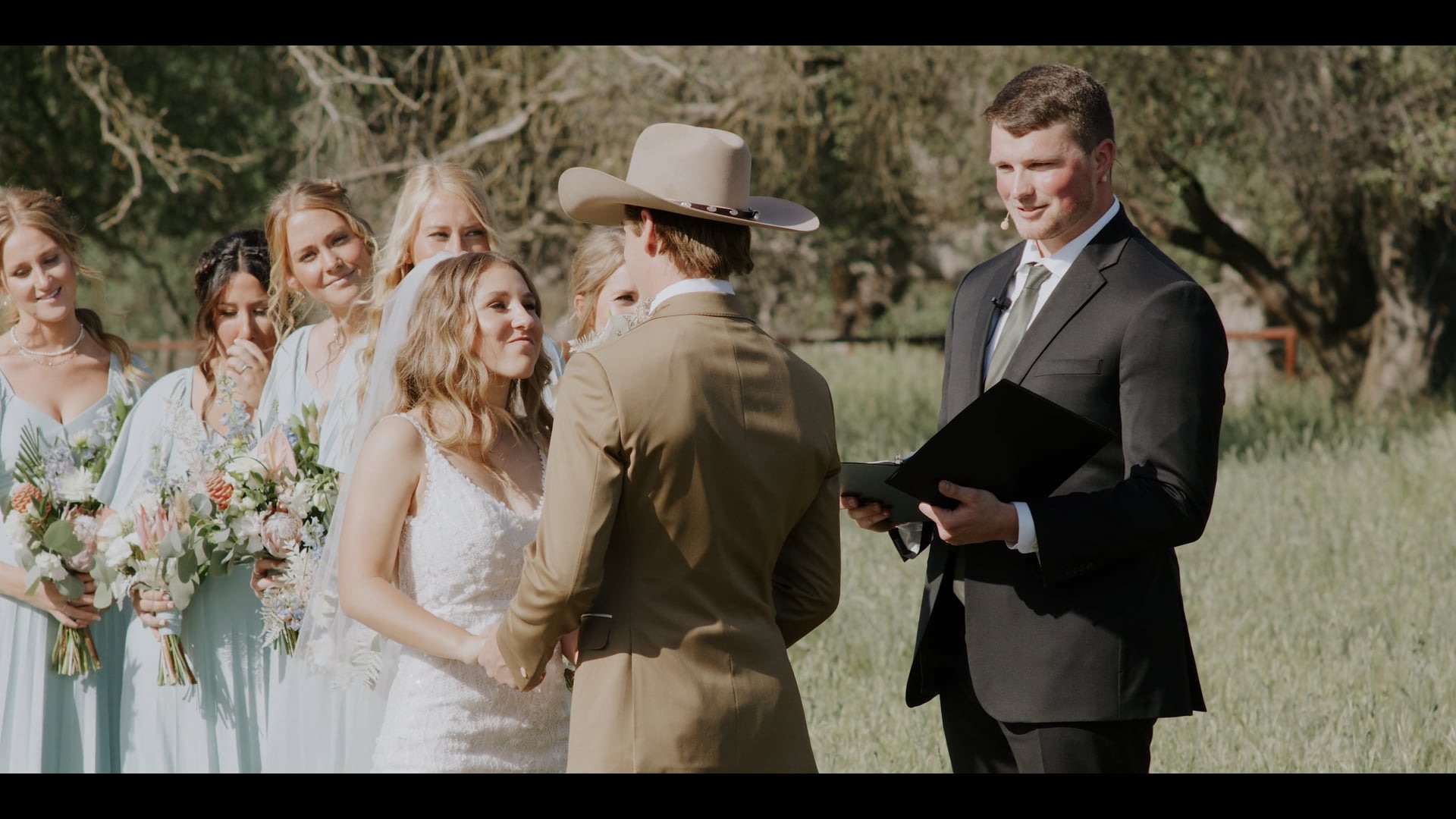 Cal and Khloe's wedding ceremony under the oaks in Kingsburg, California