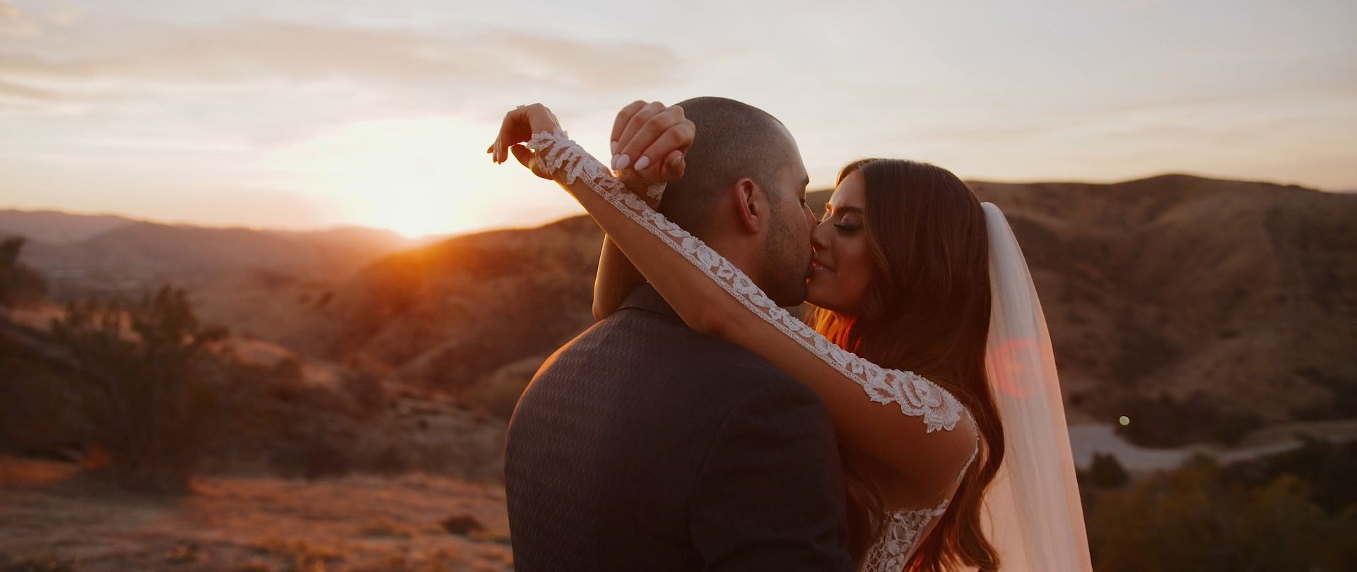 Edmond and Lauren kiss at sunset above the Simi Valley hills