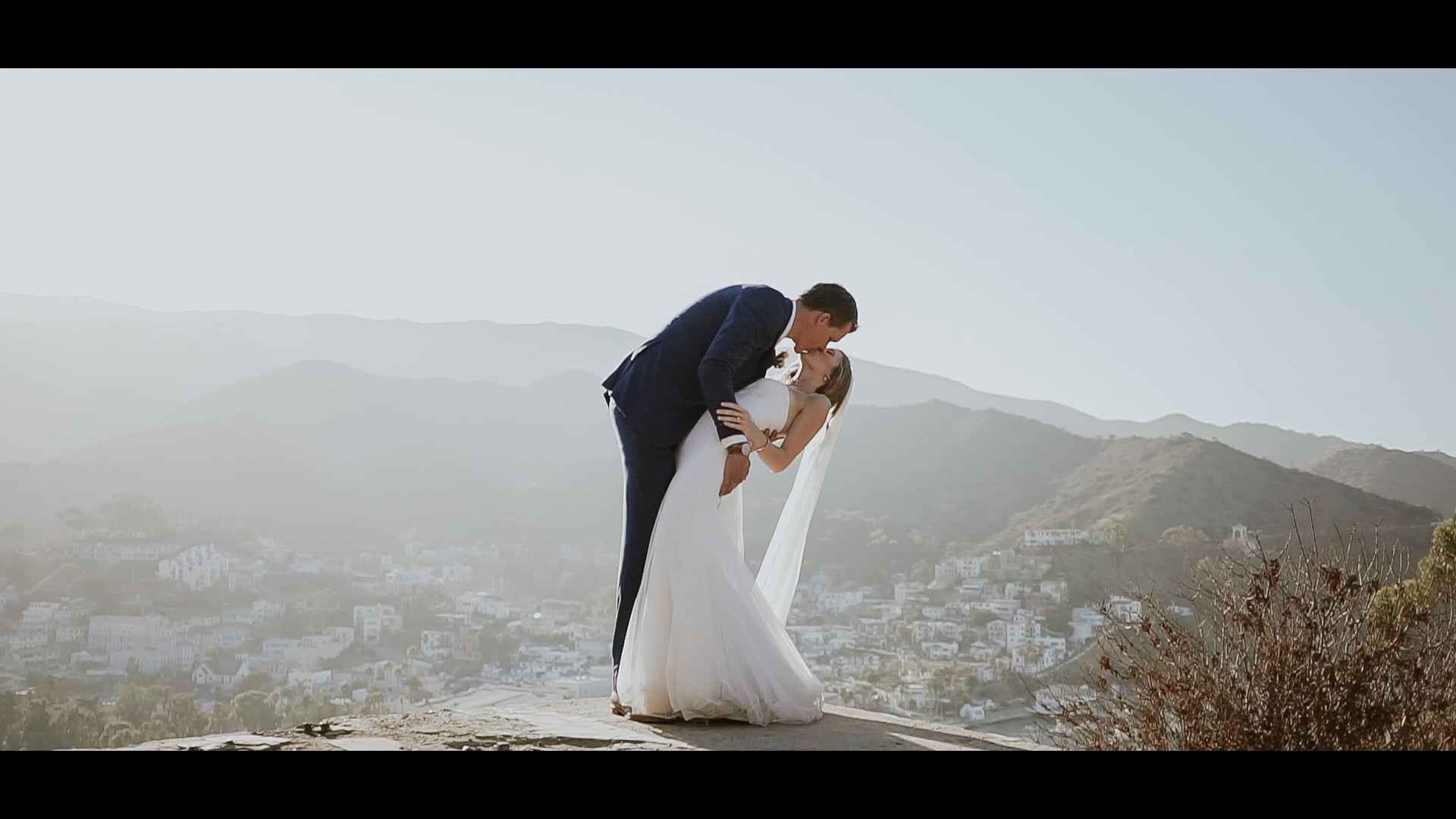 Kyle dipping Ava on the hillside above Avalon harbour on Catalina Island
