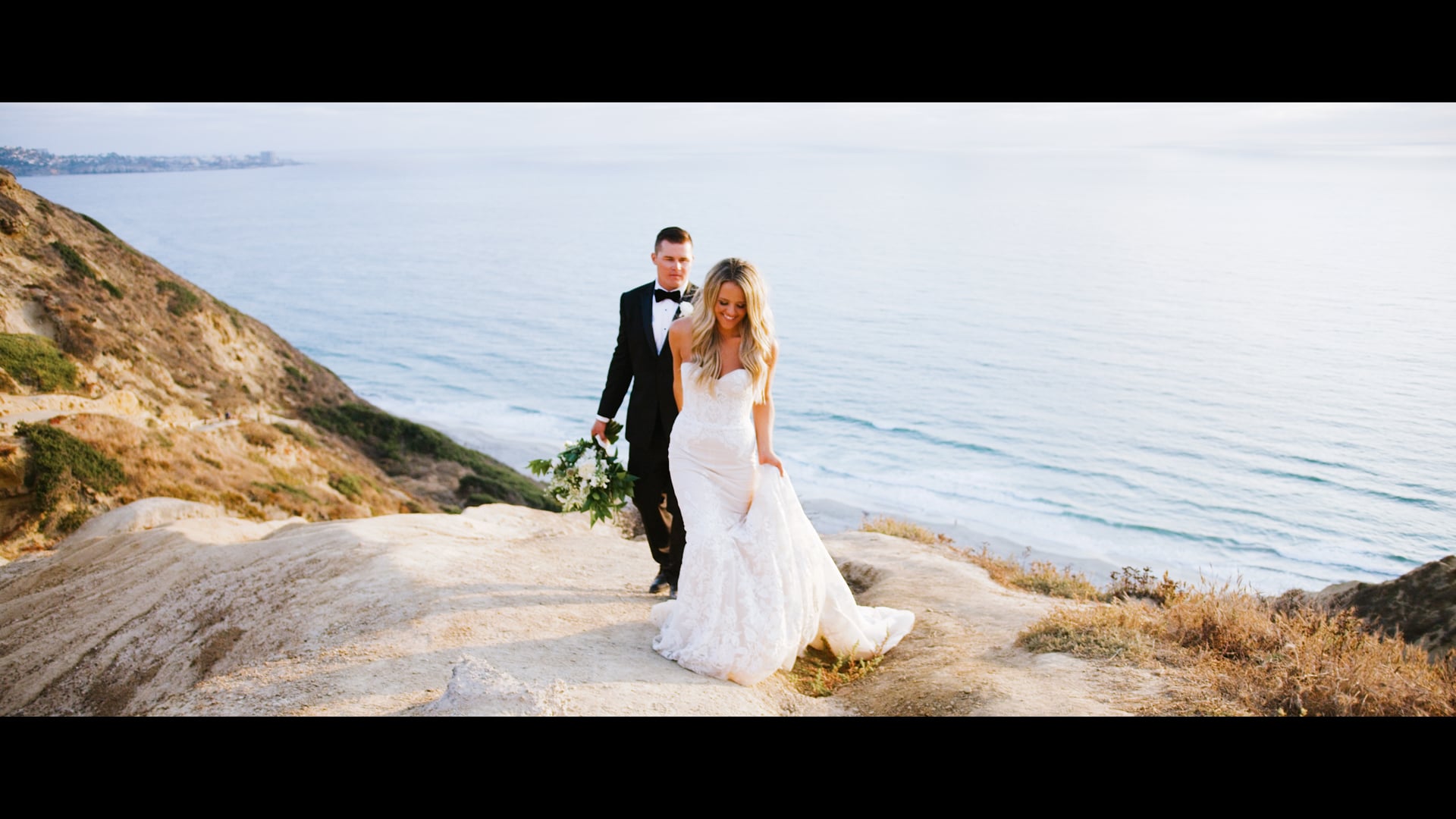 Nick and Paige on the sandstone bluffs above the water at La Jolla