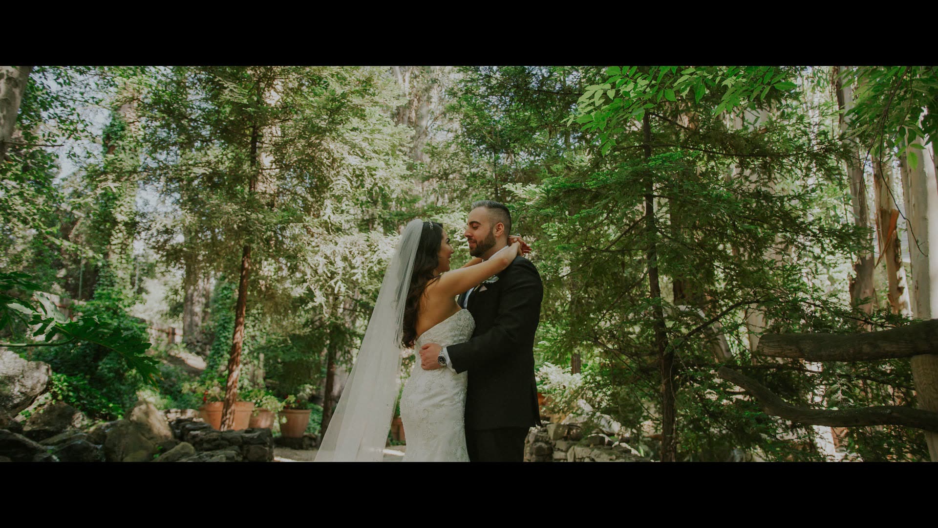 Nima and Donya together beneath the redwoods at Calamigos Ranch