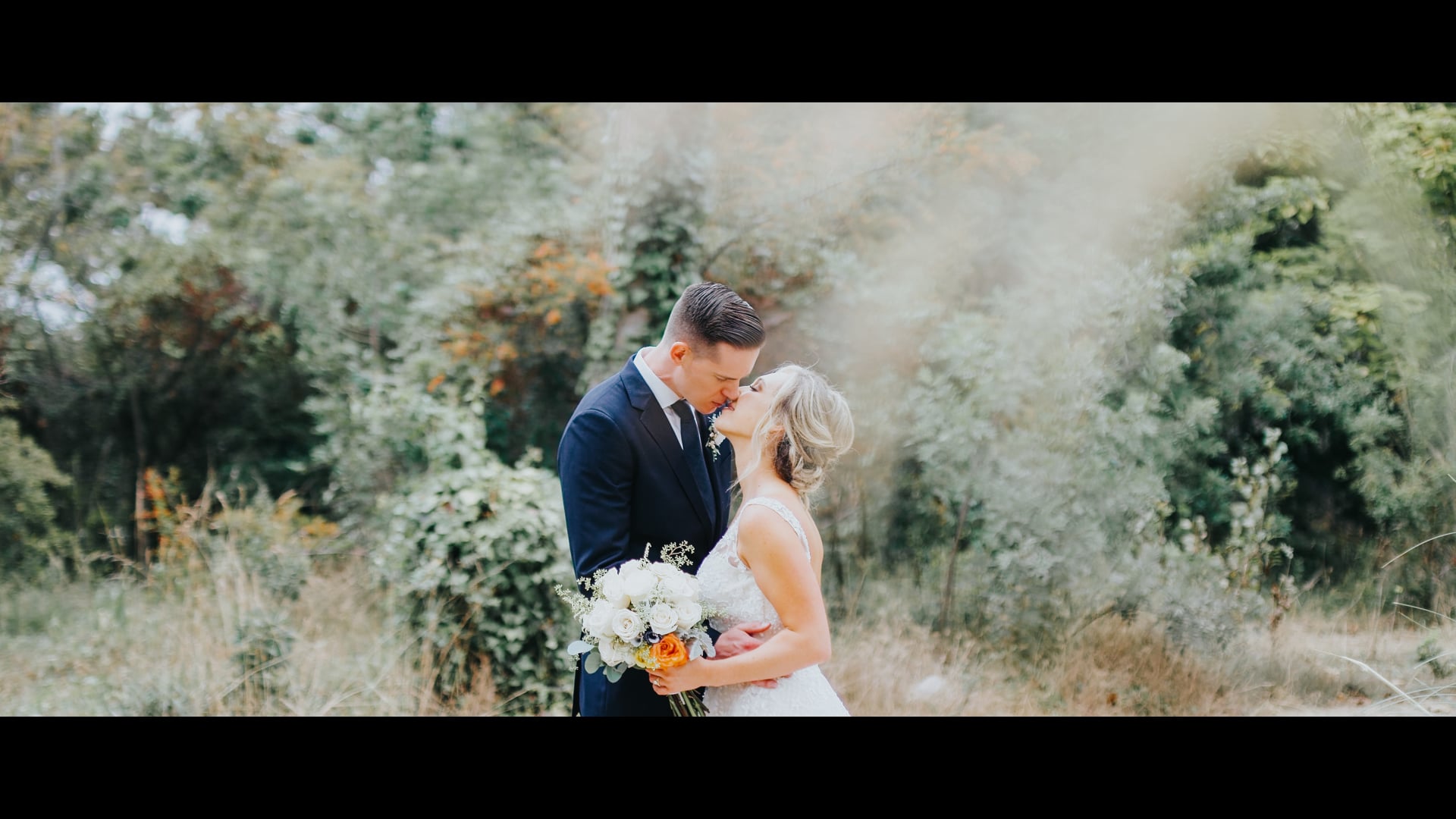 Teddy and Lindsay standing together in the tall coastal planting on the Palos Verdes bluffs