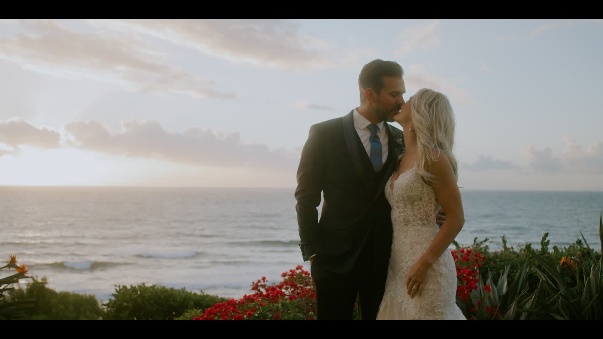 Tony and Katherine on the bluff at The Ritz-Carlton, Laguna Niguel with the Pacific and the coastline behind them