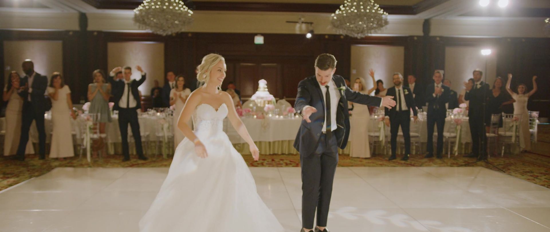 Garrison and Meredith alone on the ballroom floor for their first dance, the tables ringed around them.
