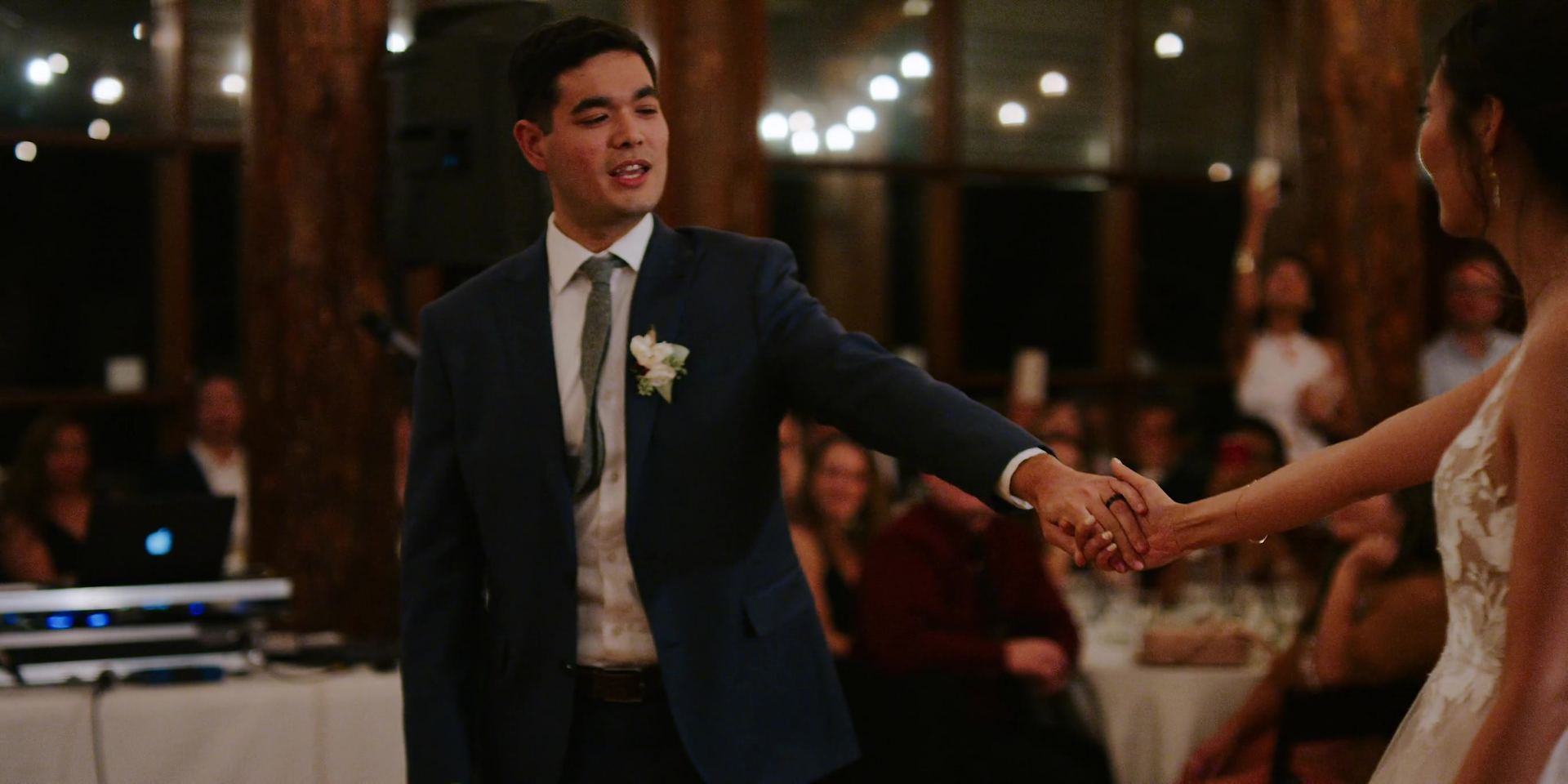 Their first dance under the lodge's string lights.