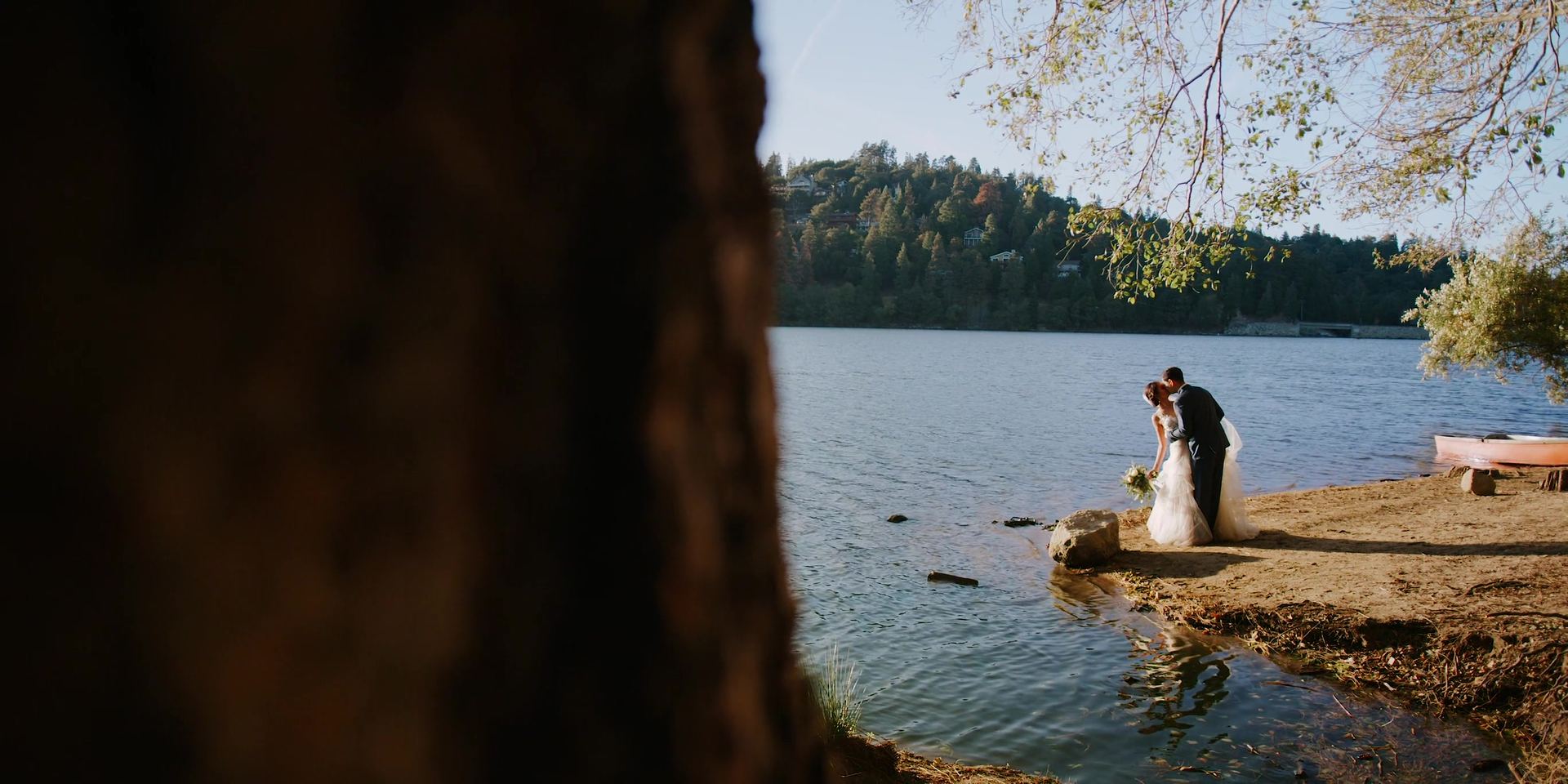 The two of them down at the lake, framed by the trees.
