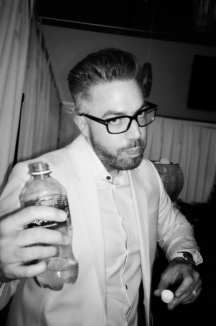 Jason Shelton, founder of Rayne Wedding Films, photographed at a wedding reception
