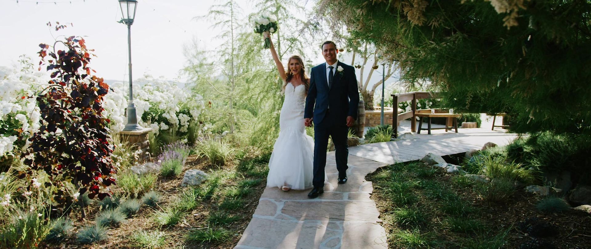 Jonathan and Breanna walking the garden path together.