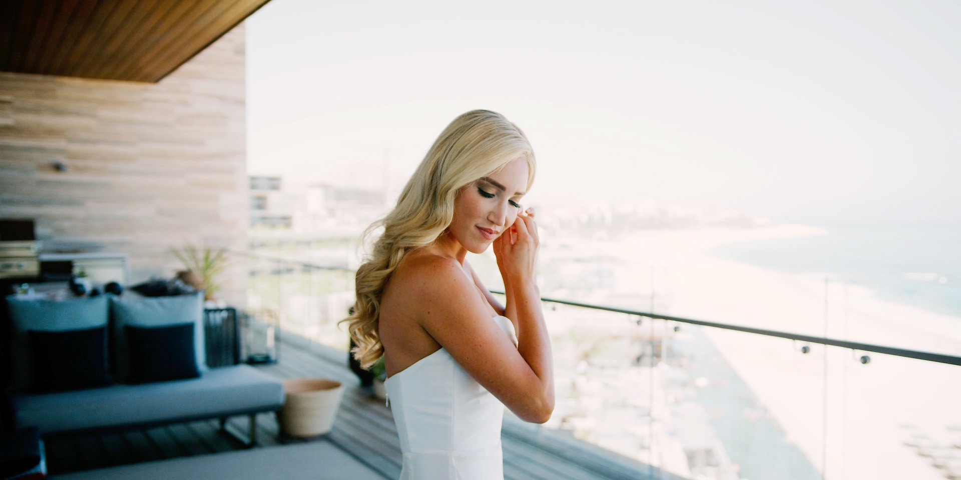Bride getting ready on an oceanfront balcony in San Jose del Cabo, Mexico