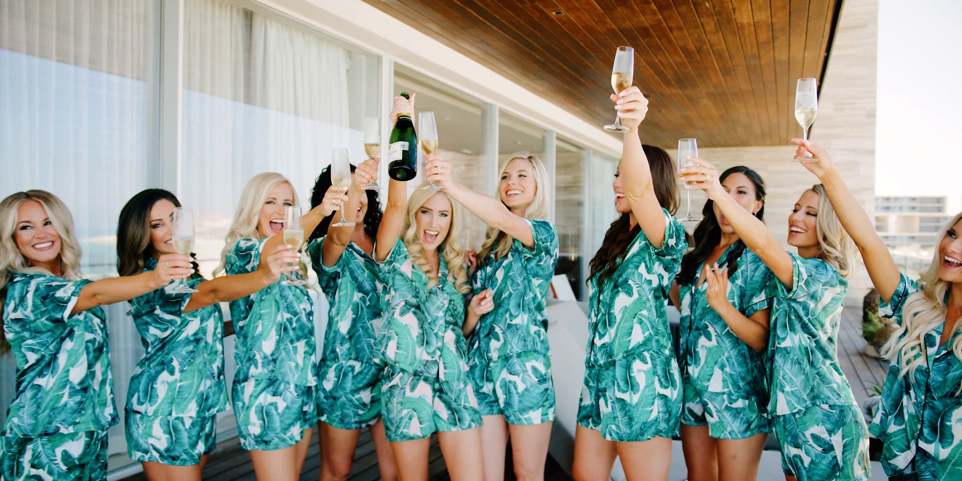 Bridesmaids toasting with champagne on the balcony before a San Jose del Cabo wedding