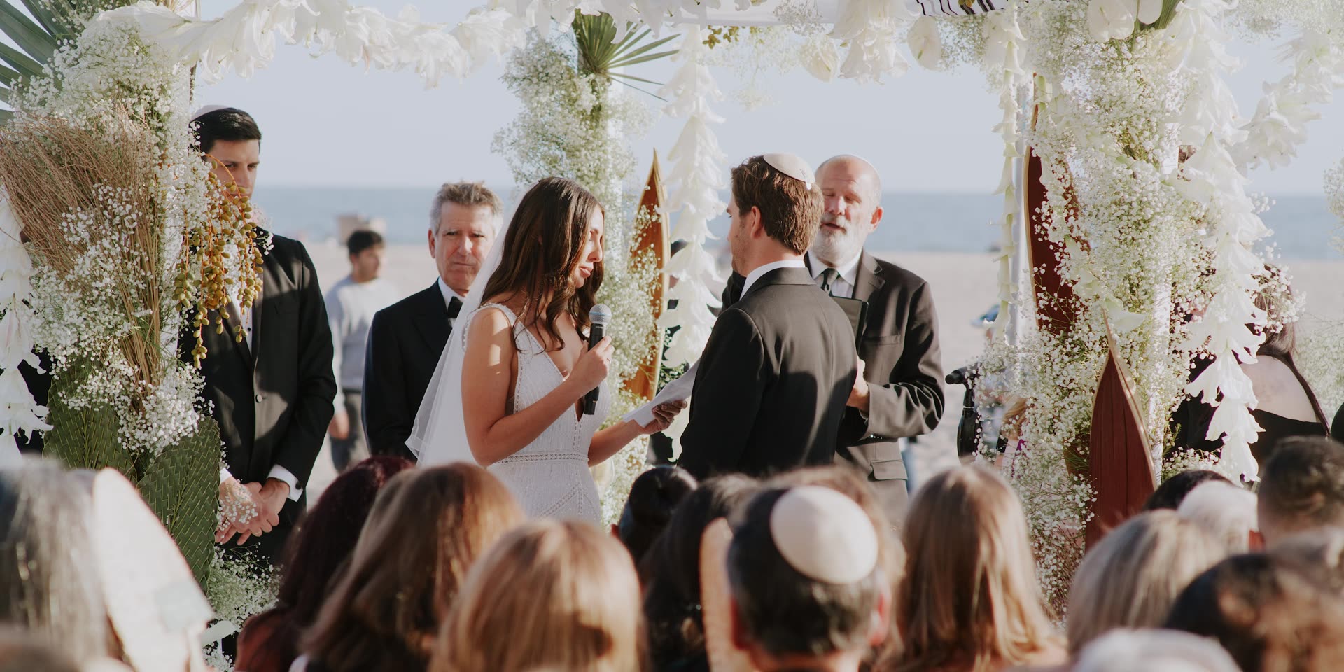 Jeremy and Lauren's ceremony on the sand with the Pacific behind them at Hotel Casa Del Mar