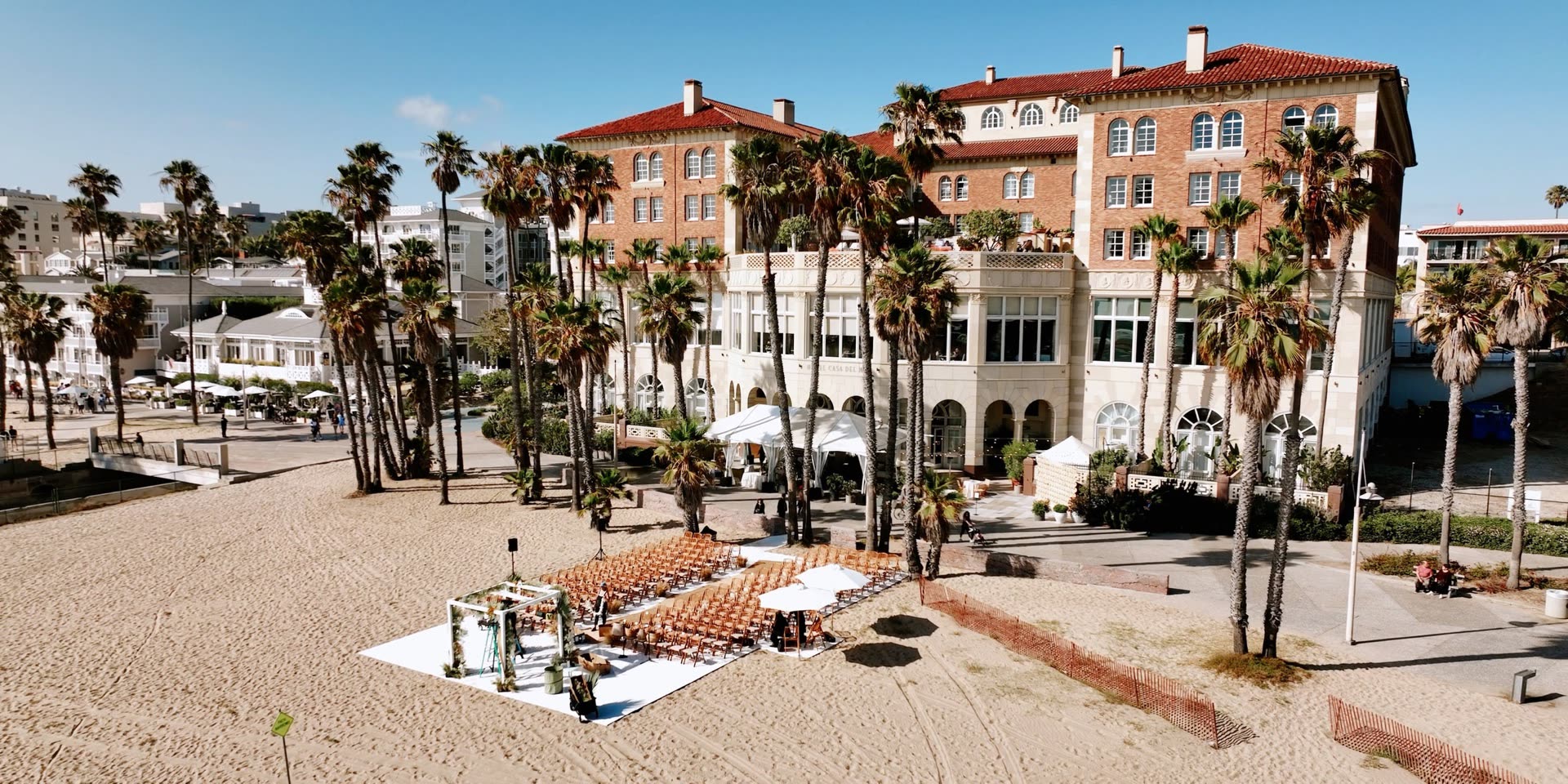Aerial view of Hotel Casa Del Mar, the historic beachfront landmark on the Santa Monica sand, set for a wedding ceremony