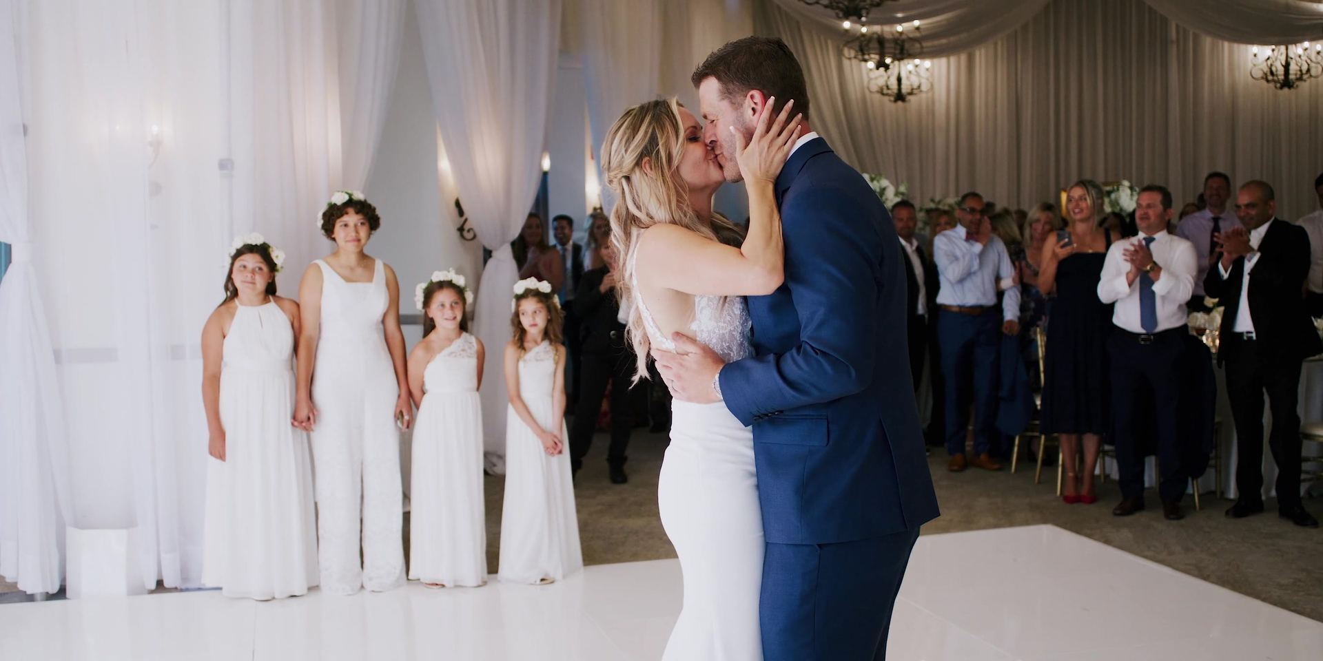 Justin and Mimi kissing on the white dance floor at the Bel-Air Bay Club