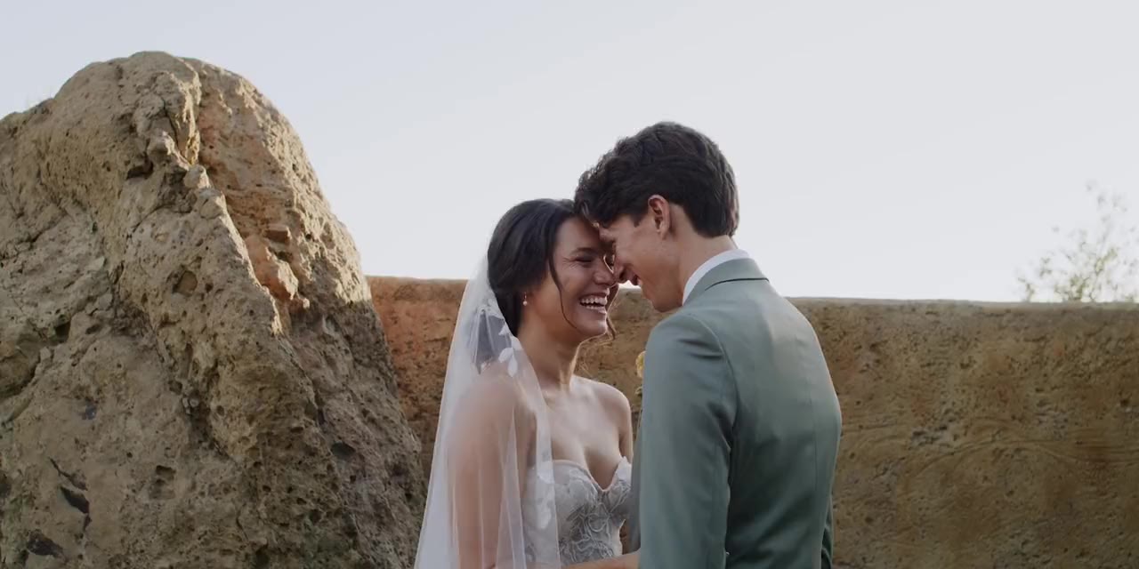Jacob and Malia forehead to forehead at sunset above Malibu