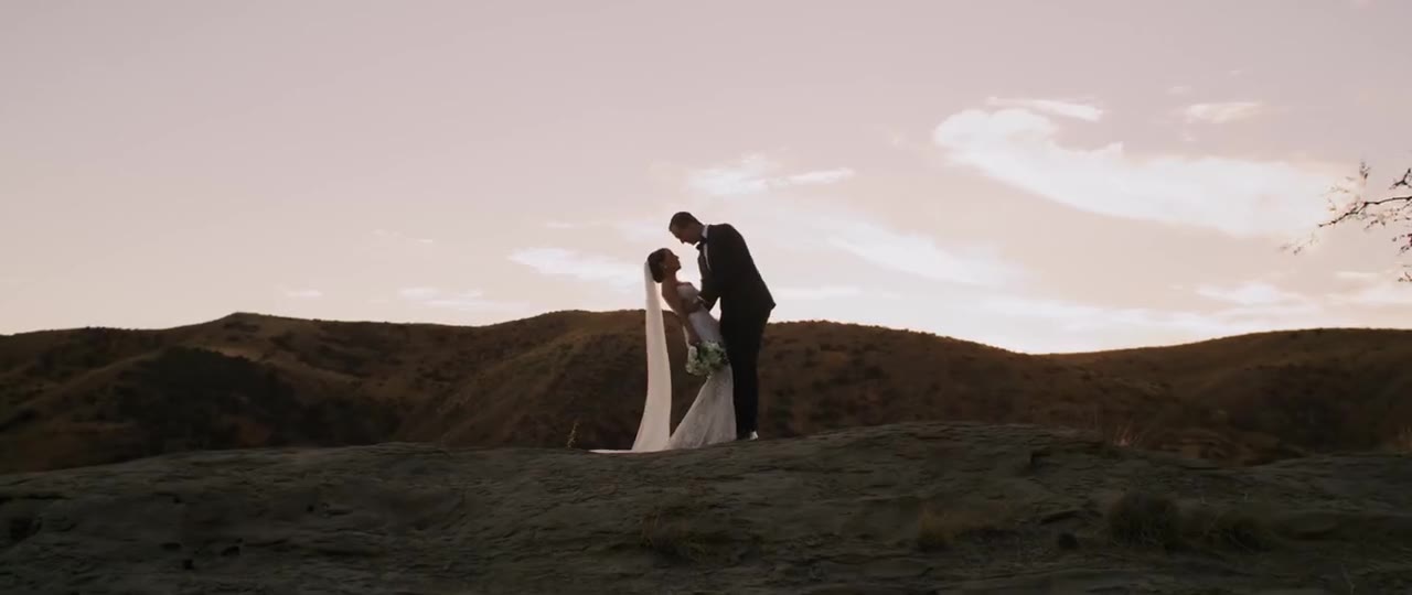 Luke and Anna silhouetted against the sunset sky in the Santa Susana hills