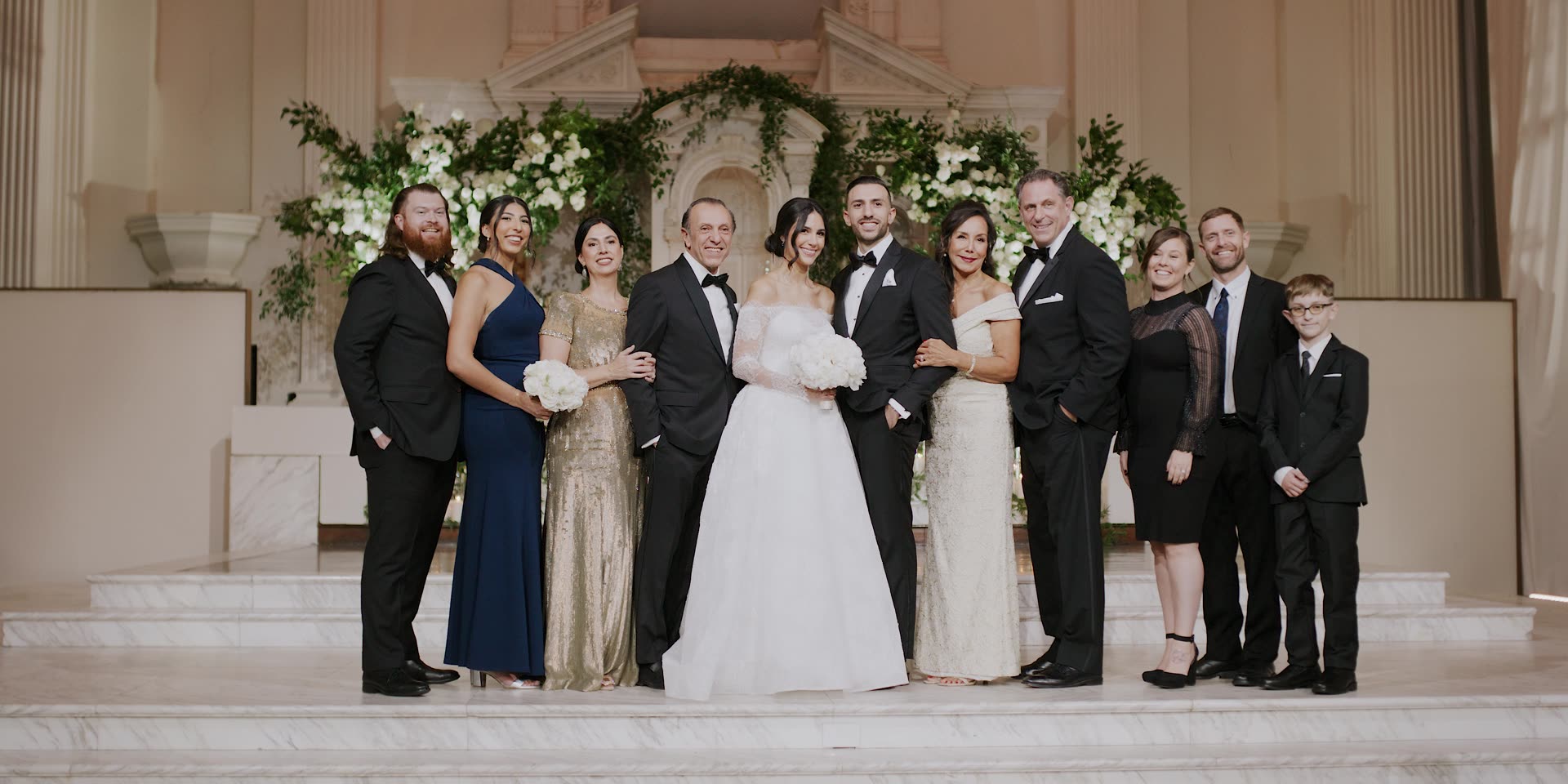 A family portrait at the altar in the white sanctuary at Vibiana