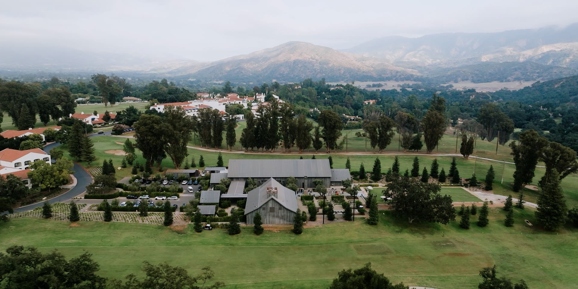 The Ojai Valley Inn Farmhouse venue in the Ojai valley with morning mist over the Topa Topa mountains