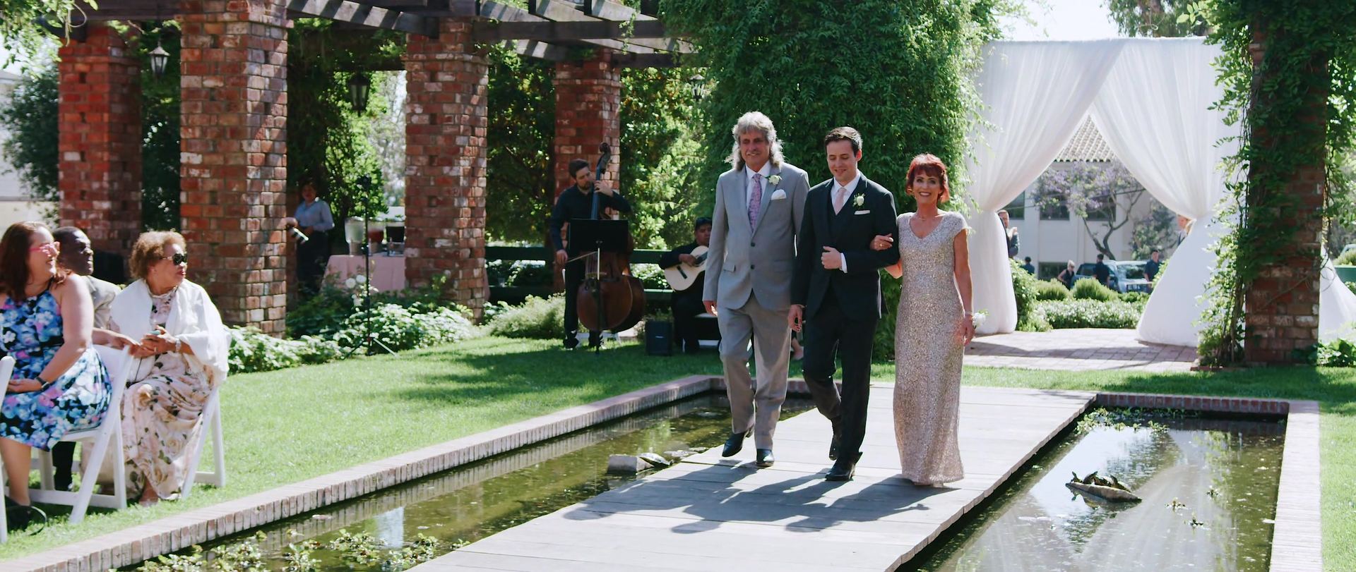 The processional along the lily pond, the brick colonnade running the length of the water.