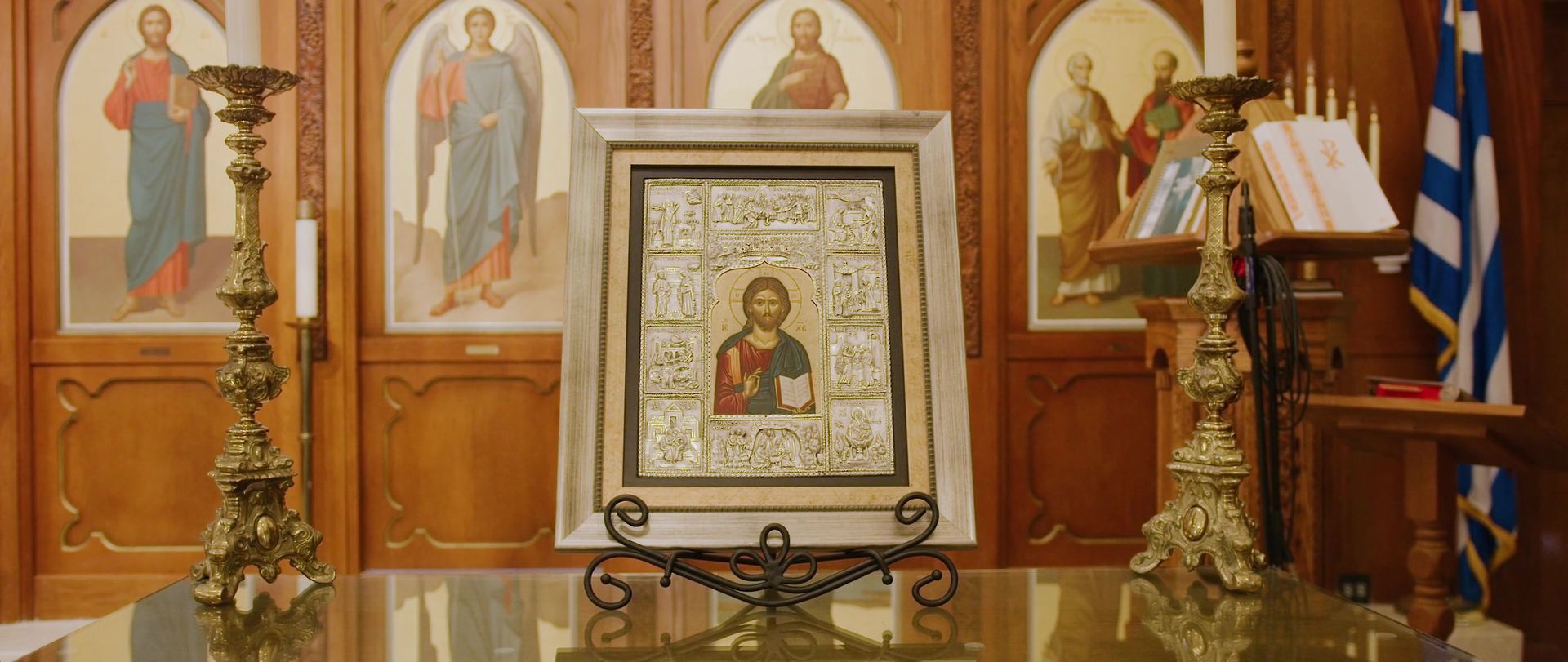 The icons and candles at the altar of the Greek Orthodox church.